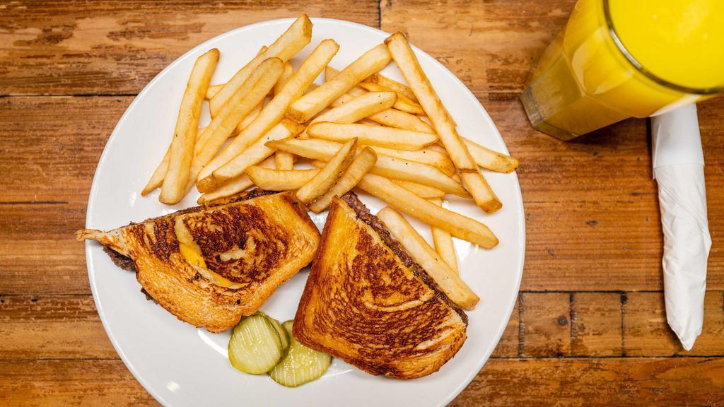 Patty Melt · Char-grilled burger sandwiched between grilled rye with melted American cheese and sautéed onion.