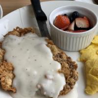 Chicken Fried Steak · Seasoned and breaded in house and covered in cream gravy.