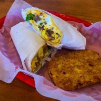 Breakfast Burrito · Two scrambled eggs with jalapenos, cheese, ham, green peppers, onions and salsa sealed in a ...