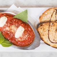 House Made Meatballs · Two meatballs in our meatball marinara served with fresh mozzarella and bread.