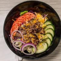 Steak · Fresh romaine and iceberg lettuce topped with shredded carrots, red cabbage, tomatoes, cucum...