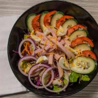Chef · Fresh romaine and iceberg lettuce topped with shredded carrots, red cabbage, tomatoes, cucum...