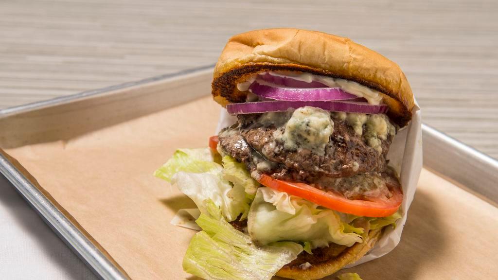 Blue Cheese · Two beef patties, blue cheese crumbles, lettuce, tomato, sliced red onion and mayo.