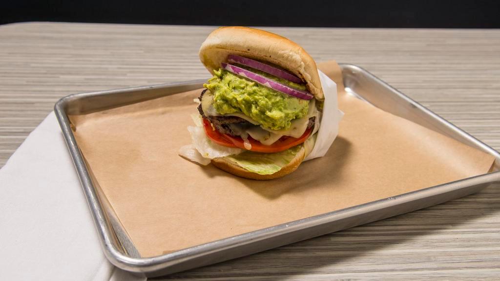 Guacamole Burger · Two beef patties, fresh guacamole, lettuce, tomato, sliced red omion, and pepper jack cheese.