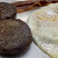 Texas Breakfast · 2 Eggs any style , 2 Bacon, 2 Sausage Patties  with choice of Pancakes , Waffle Or French To...