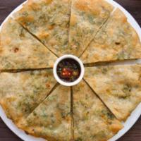 Green Onion Pie - Full Pie · Crispy, flaky, tender scallion pancakes served with chili soy sauce