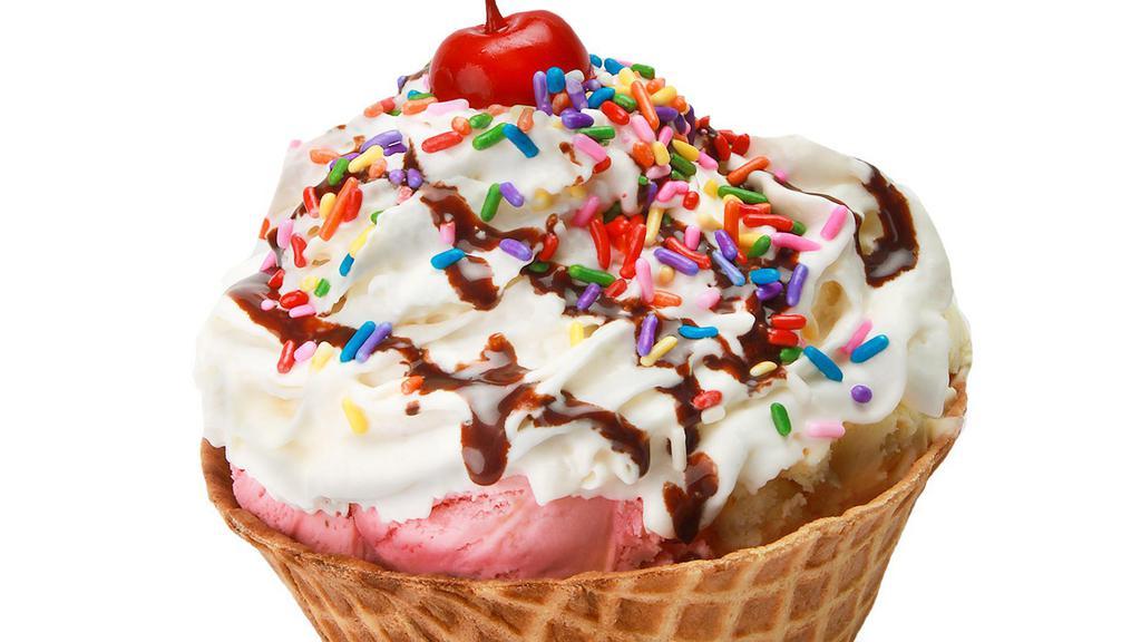 Cazuela Deluxe · A waffle bowl with  three scoops of ice cream, whipped cream, chocolate syrup, sprinkles & a cherry.