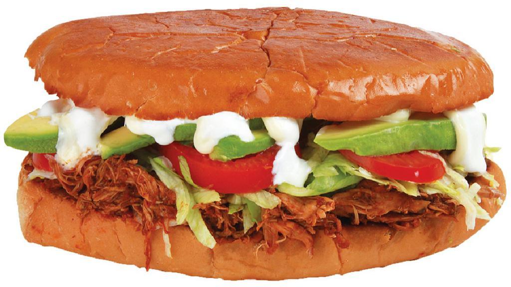Torta De Tinga De La Gaby (Spicy) · Shredded chicken in our house special sauce, beans, mayo, lettuce, tomato, avocado and sour cream with jalapeño on the side.