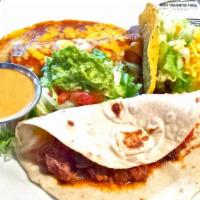 Larry'S Plate · One beef enchilada, a crispy taco, guacamole salad, chili con queso. And a carne guisada taco.