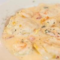 Chicken & Shrimp Cremora Mushroom · Sautéed chicken breast and shrimp with mushrooms in a creamy white wine sauce served over pa...