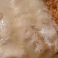 Enchiladas Blancas · Three chicken enchiladas covered with a homemade white sauce and Monterey cheese, served wit...