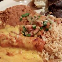Tampiqueña · One six oz. beef or chicken fajita and one cheese enchilada. Served with rice, beans, pico d...