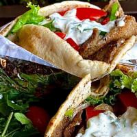 Gyros Sandwich · Sliced beef and lamb gyros, onion, lettuce, tomato, with tzatziki sauce and soma on pita.
