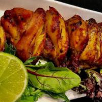 Cornish Hen Kabob · A whole Cornish hen chunked ,marinated an charbroiled served saffron rice and grill tomatoes