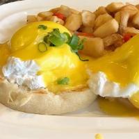 Traditional  · English muffin, Canadian bacon, two poached eggs and hollandaise sauce, served with breakfas...