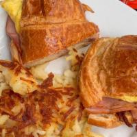 Deluxe Breakfast Croissant Platter (Per Person) · Fluffy scrambled eggs, ham and cheddar; on our award-winning butter croissant.