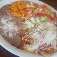 Enchiladas De Nopalitos · With rice and beans with red sauce.