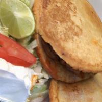 Gordita Plate · Two gorditas with rice, beans and salad.