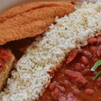 Cajun Executioner · Fried catfish filet served with cornbread and red beans and rice.