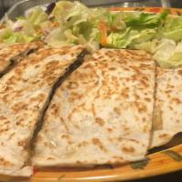 Quesadilla Platter · Vegetarian. Cheese-filled flour tortillas served with lettuce, guacamole, and sour cream,