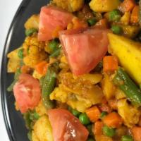 Mix Vegetable Curry · Nine fresh vegetables cooked with curry sauce. Vegan.