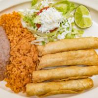 Flautas Plate · Served with five corn flautas , beans, rice, salad, sour cream, and avocado.
