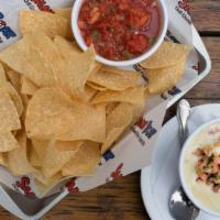 Queso Blanco Cup · Served with fresh salsa + tortilla chips