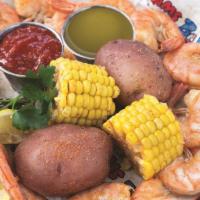 Boiled Shrimp With Potatoes + Corn · 1 pound Jumbo Shrimp served with drawn butter, cocktail sauce, 2 corn on the cob and 2 red p...