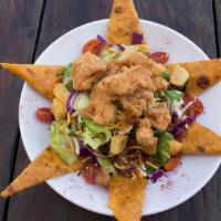 Crispy Chicken Salad · Popcorn chicken with tomatoes, jalapeno cheese quesadillas, bacon, mixed greens + honey must...