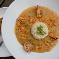 Shrimp + Crawfish Etoufee · Crawfish tails  + jumbo shrimp  smothered is a butter blend of onions peppers, celery, + gar...