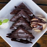 Chocolate Chip Brownie · Warm brownie wedges, homemade vanilla ice cream, chocolate sauce + whipped cream