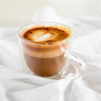 Cortado · 2 ounces (2 shots) of Espresso mixed with 2 ounces of drizzled  steamed warm milk. (Flavors ...