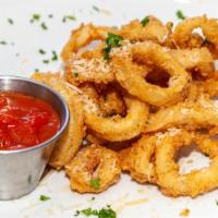 Crispy Fried Calamari · Lightly breaded topped Parmesan cheese served with marinara sauce.