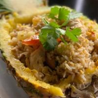 Pineapple Fried Rice · Thai style-fried rice with choice of chicken, pork, or tofu. Beef and shrimp for an addition...
