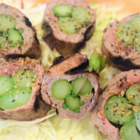 Beef Asparagus Roll · Sliced beef roll with asparagus.