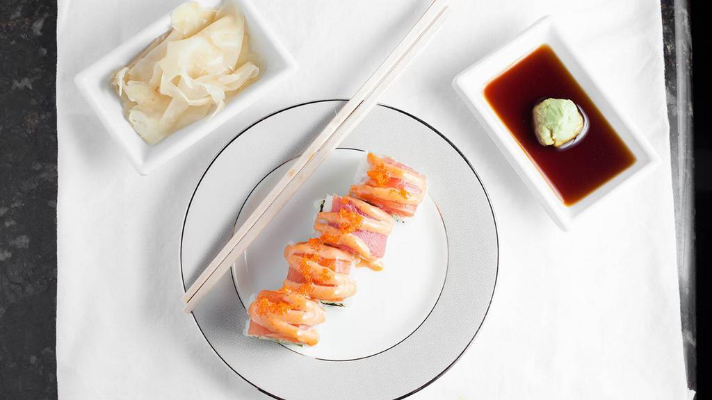Rocky Mountain Roll · Shrimp tempura, cream cheese and cucumber, tempura style, topped with smoke salmon, avocado and miso dressing.