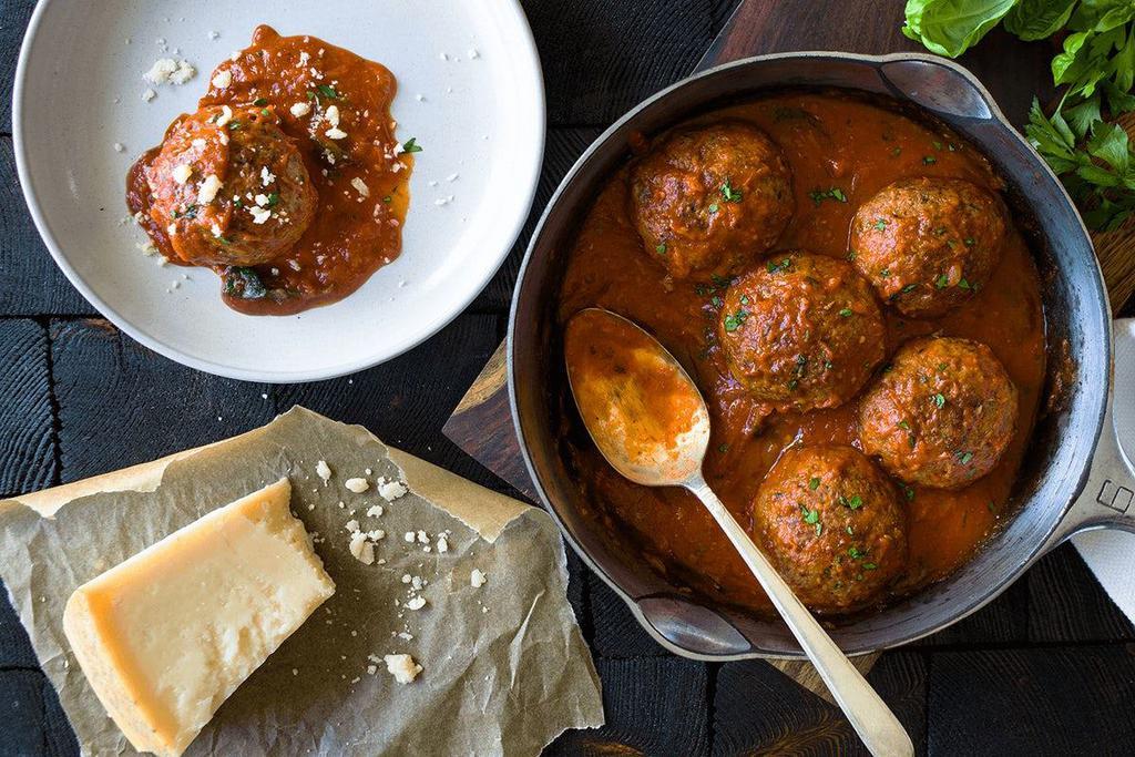 Grass-Fed Meatballs · Three all-beef meatballs rolled with Italian breadcrumbs and topped with pomodoro sauce and parmesan