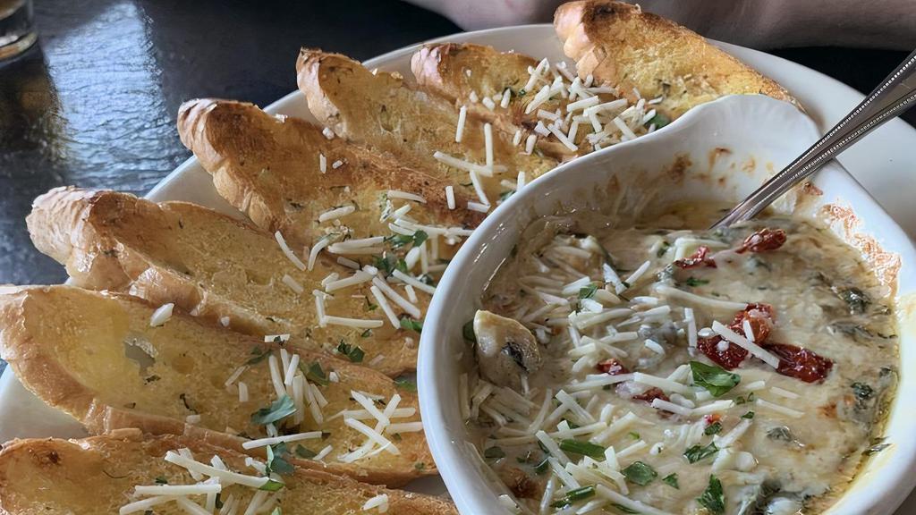 Spinach & Artichoke Formaggio · Freshly prepared with spinach, artichokes and mushrooms in a creamy blend of cheeses. Served with toasted garlic bread.
