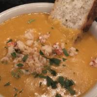 Lobster Bisque · Thick and creamy, garnished with fresh lobster morsels.