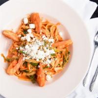 Shrimp Fra Diavolo · Tender jumbo shrimp sautéed with garlic, asparagus, and spinach in a creamy spiced pomodoro ...