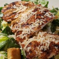 Chicken Caesar Salad · Crisp romaine, garlic cheese croutons, and grated Parmesan cheese tossed in Caesar dressing.