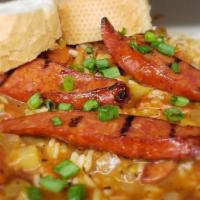 Jambalaya · Shrimp, andouille sausage, tomatoes, onions, celery, garlic, green bell peppers, and white r...