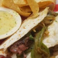 Pot Roast Tacos · Slow roasted pot roast, sauteed onions, cheddar jack cheese & cabbage with flour tortillas. ...
