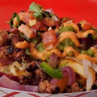 Loaded Yaroa Fries · Basket of fries topped with imported Dominican salami and pork sausage, grilled onions, and ...