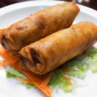 Crispy Spring Rolls · Fried egg roll wrappers filled with glass noodles and assorted vegetables, served with sweet...