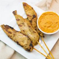 Satay · Marinated with spices and coconut milk, grilled and served with peanut sauce