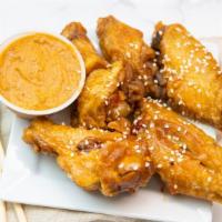 Wings · Deep fried chicken wings mixed with choice of sauces: Thai hot, sweet chili, or four seasons