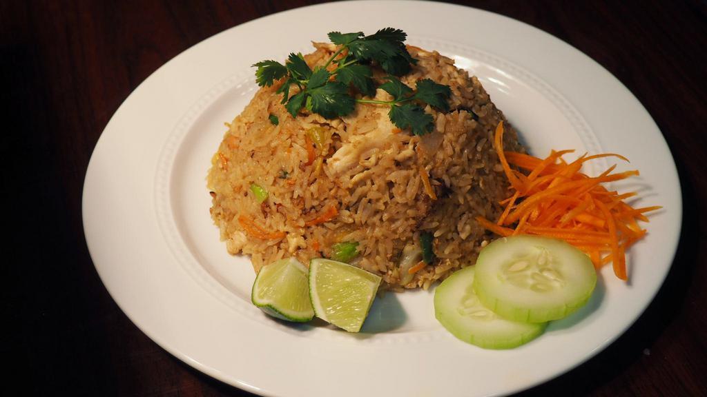 Fried Rice · Stir-fried rice with egg mixed sweet onion, carrot, tomato, and green onion with light sauce