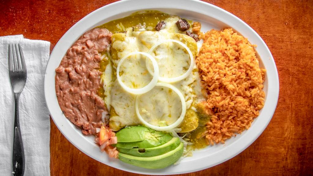 Homero'S Favorite Enchiladas · Three barbacoa enchiladas with our special super hot jalapenos salsa or mild green salsa laurita, white cheese on top served with rice and beans.