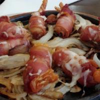 Brochette Can-Cun · Eight grilled shrimp wrapped in bacon and jalapeno pepper with melted white cheese on top. S...